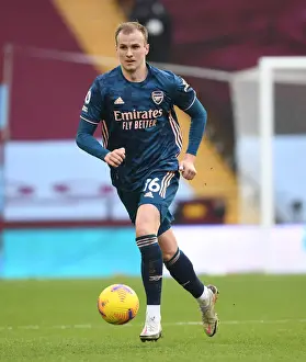 Rob Holding in Action at Empty Villa Park: Arsenal's Premier League Match Amidst COVID-19 Restrictions, February 2021