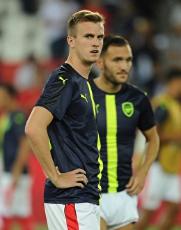 Paris Saint Gernain V Arsenal 2016-17 Prints: Rob Holding's Steely Gaze: Arsenal's Defender Prepares for Paris Saint-Germain Champions League Showdown