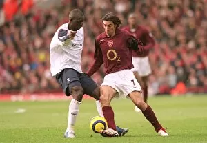 Arsenal v Bolton 2005-6 Collection: Robert Pires (Arsenal) Abdoulaye Faye (Bolton). Arsenal 0: 1 Bolton Wanderers