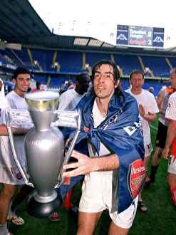 Robert Pires (Arsenal) celebrates winning the League