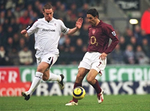 Bolton v Arsenal 2005-6 Collection: Robert Pires (Arsenal) Kevin Nolan (Bolton). Bolton Wanderers 2: 0 Arsenal