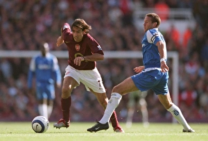 Arsenal v Birmingham 2005-6 Gallery: Robert Pires (Arsenal) Matthew Upson (Birmingham). Arsenal 1: 0 Birmingham City