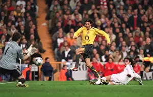 Robert Pires (Arsenal) has his shot saved by Iker Casillas as Perez Mejia