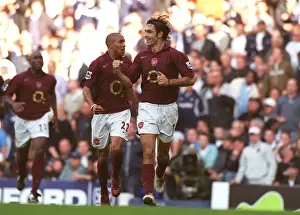 Robert Pires celebrates scoring the Arsenal goal with Gael Clichy