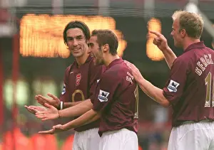 Robert Pires celebrates scoring Arsenals goal from the penalty spot with Matthieu Flamini