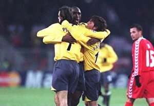 Campbell Sol Collection: Robert Pires celebrates scoring a goal for Arsenal with Sol Campbell and Cesc Fabregas