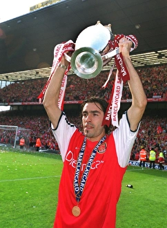Robert Pires with the F. A. Barclaycard Premiership Trophy