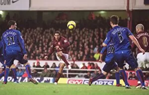 Images Dated 14th January 2006: Robert Pires scores Arsenals 4th goal past Chris Riggott (Middlesbrough)