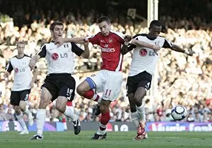 Fulham v Arsenal 2009-10 Collection: Robin van Perise (Arsenal) Aaron Hughes and John Pantsil (Fulham)