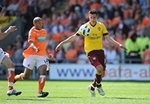 Images Dated 10th April 2011: Robin van Persie (Arsenal) Alex Baptist (Blackpool). Blackpool 1: 3 Arsenal