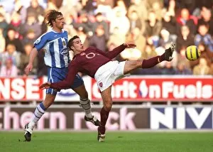 Images Dated 21st November 2005: Robin van Persie (Arsenal) Arjan Dezeeuw (Wigan)
