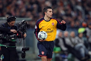 AS Roma V Arsenal 2008-9 Prints: Robin van Persie (Arsenal) and a cameraman