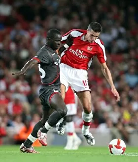 Images Dated 27th August 2008: Robin van Persie (Arsenal) Cheick Tiote (Twente)