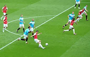Robin van Persie (Arsenal) chips the ball against the post under pressure from Kieran Richardson