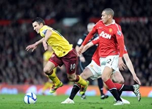 Manchester United v Arsenal FA Cup 2010-11 Collection: Robin van Persie (Arsenal) Chris Smalling (Man United). Manchester United 2: 0 Arsenal