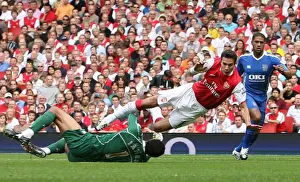 Robin van Persie (Arsenal) is fouled by David James (Portsmouth) for Arsenals penalty