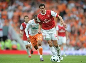 Images Dated 21st August 2010: Robin van Persie (Arsenal) Ishmel Demontagnac (Blackpool). Arsenal 6: 0 Blackpool