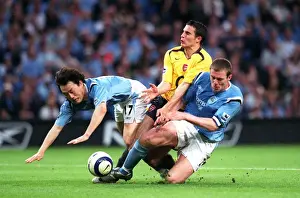 Robin van Persie (Arsenal) Jihai Sun and Richard Dunne (Man City)