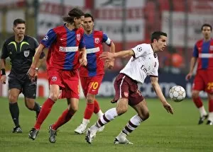 Steaua Bucharest v Arsenal 2007-08 Collection: Robin van Persie (Arsenal) Ovidiu Petre (Steaua)