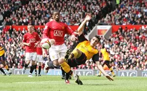 Manchester United v Arsenal 2008-09 Collection: Robin van Persie (Arsenal) Patrice Evra (Man United)