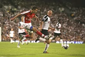 Fulham v Arsenal 2009-10 Collection: Robin van Persie (Arsenal) Paul Konchesky (Fulham)