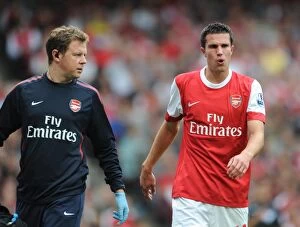 Images Dated 21st August 2010: Robin van Persie with Arsenal physio Colin Lewin. Arsenal 6: 0 Blackpool