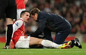 Arsenal v Fulham 2010-11 Collection: Robin van Persie (Arsenal) with Physio Colin Lewin. Arsenal 2: 1 Fulham