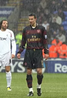 Bolton Wanderers v Arsenal 2007-8 Collection: Robin van Persie (Arsenal) in the rain