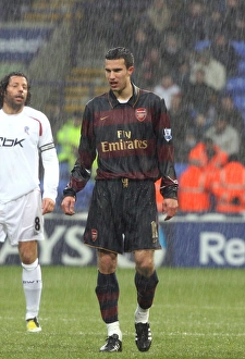 Images Dated 31st March 2008: Robin van Persie (Arsenal) in the rain
