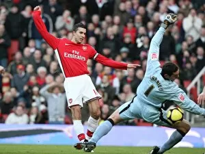 Images Dated 3rd January 2009: Robin van Persie (Arsenal) Roman Larrieu (Plymouth)