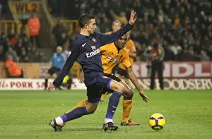 Wolverhampton Wanderers v Arsenal 2009-10 Collection: Robin van Persie (Arsenal) Ronald Zubar (Wolves)