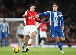 Images Dated 6th December 2008: Robin van Persie (Arsenal) Ryan Taylor (Wigan)