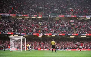 Robin van Persie (Arsenal) scores his penalty in the shoot out past Roy Carroll (Man Utd)