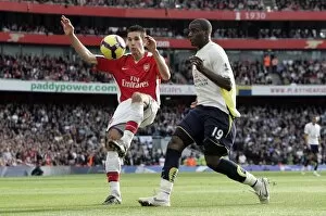 Arsenal v Tottenham 2009-10 Collection: Robin van Persie (Arsenal) Sebastien Bassong (Tottenham)