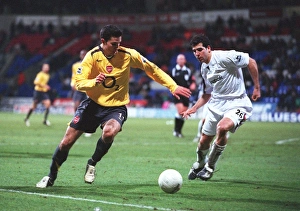 Bolton v Arsenal - FA Cup 2005-06 Collection: Robin van Persie (Arsenal) Tal Ben Haim (Bolton). Bolton Wanderers 1: 0 Arsenal