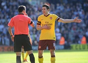 Robin van Persie (Arsenal) talks with referee Stuart Atwell. West Bromwich Albion 2