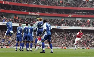 Robin van Persie (Arsenal) watches his free kick beat the wall but go wide of the goal