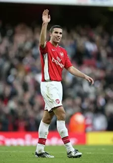 Images Dated 18th October 2008: Robin van Persie (Arsenal) waves to his family after the match