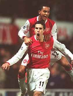 Watford v Arsenal Collection: Robin van Persie celebrates scoring the 2nd Arsenal goal with Theo Walcott