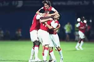 Robin van Persie celebrates scoring the 2nd Arsenal goal with Cesc Fabregas