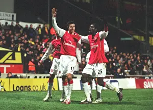 Robin van Persie celebrates scoring the 2nd Arsenal goal with Emmanuel Adebayor