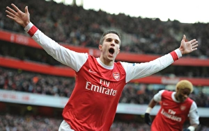 Arsenal v Wigan Athletic 2010-11 Collection: Robin van Persie celebrates scoring his and Arsenals 1st goal. Arsenal 3
