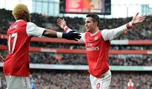 Arsenal v Wigan Athletic 2010-11 Collection: Robin van Persie celebrates scoring his and Arsenals 1st goal with Alex Song