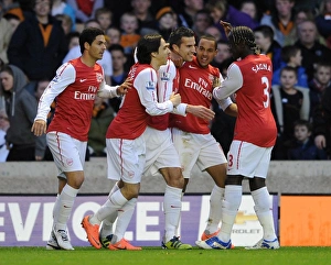 Robin van Persie celebrates scoring Arsenals 1st goal with his team mates Robin van Persie celebrates scoring Arsenals 1st goal with his team mates