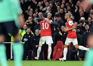 Robin van Persie celebrates scoring Arsenals 1st goal with Arsenal Manager Arsene Wenger