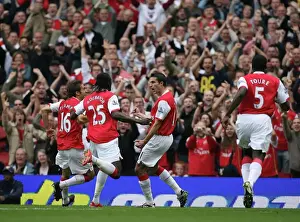 Robin van Persie celebrates scoring Arsenals and his 1st goal with Mathieu Flamini