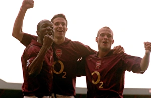 Lauren Collection: Robin van Persie celebrates scoring Arsenals 2nd goal with Lauren