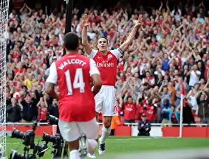 Robin van Persie celebrates scoring his and Arsenals 2nd goal, his 100th goal for Arsenal with Theo Walcott. Arsenal 3: 0 Bolton Wanderers. Barclays Premier League. Emirates Stadium, 24 / 9 / 11. Credit : Arsenal Football Club /