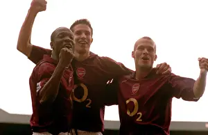 Robin van Persie celebrates scoring Arsenals 2nd goal with Lauren