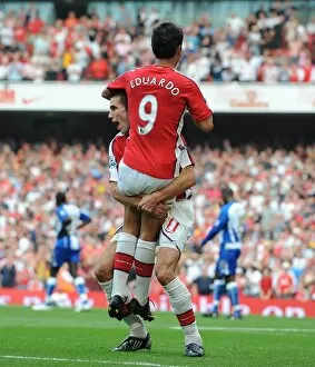 Arsenal v Wigan Athletic 2009-10 Collection: Robin van Persie and Eduardo celebrate the 3rd Arsenal